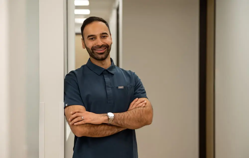 A portrait of Dr. Mo, a board-certified orthodontist in Colleyville, TX.